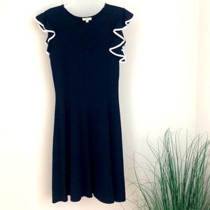 Navy knit dress with white edge on ruffle sleeves